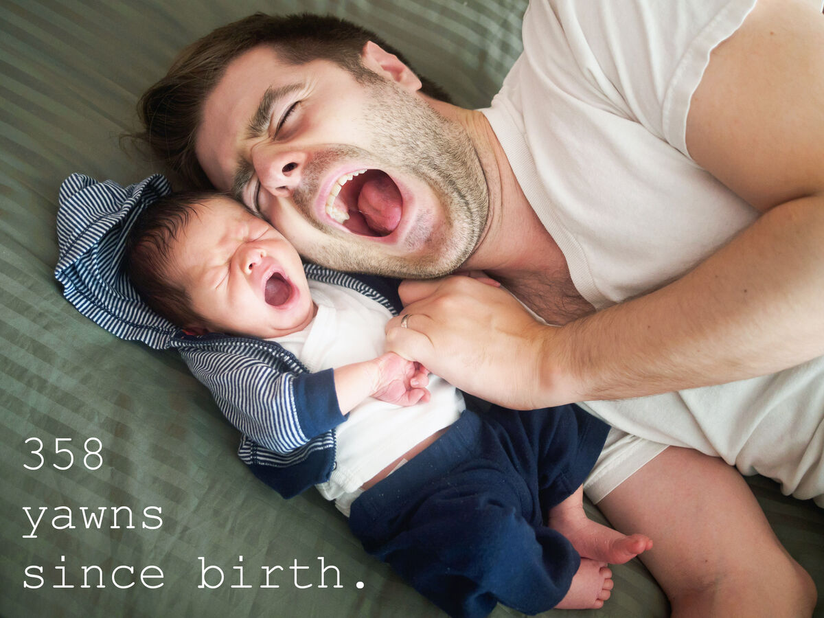 Father and son yawning