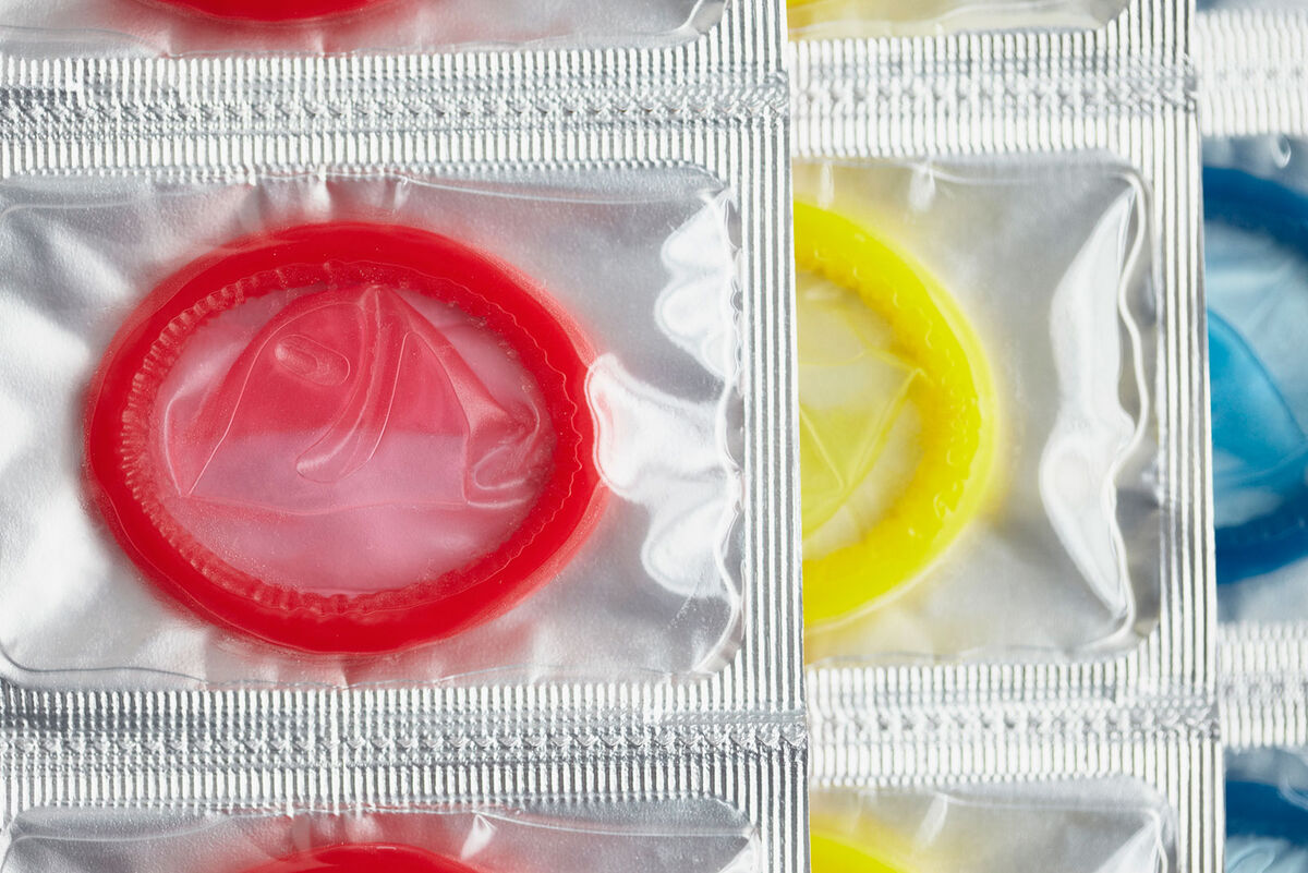 Packages of colorful condoms