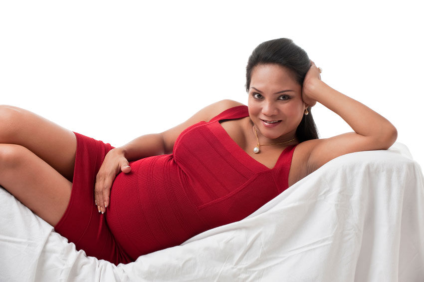 Woman wearing form-fitting maternity wear
