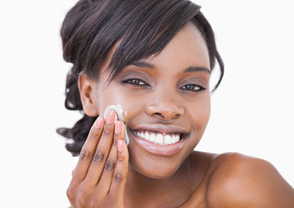 Woman using natural face cream