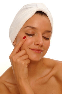 Woman Applying Eye Cream Source: iStockphoto Permission: Licensed