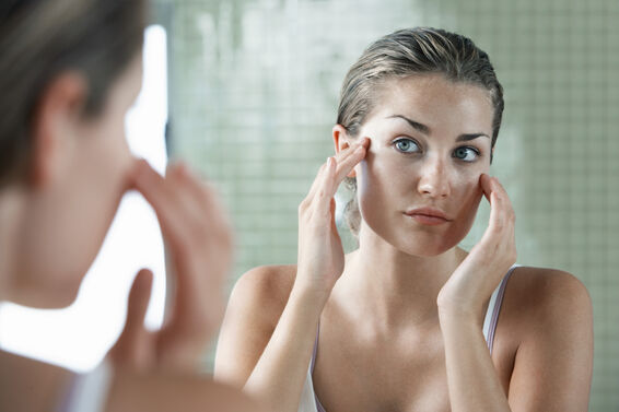 woman applying face cream