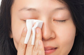 Woman Cleansing Face