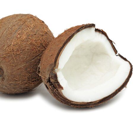 Coconut broken open for making lotion