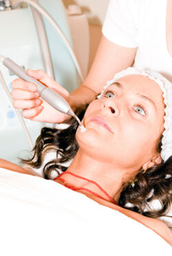 Woman Receiving Laser Skin Treatment Source: iStockphoto Permission: Licensed
