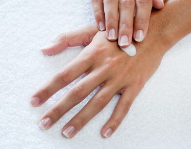 applying hand lotion