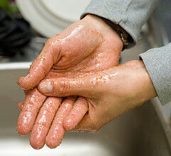 Woman exfoliating hands