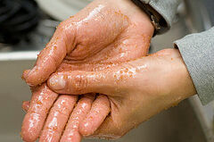 Woman exfoliating hands