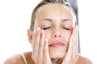 Woman washing her face
