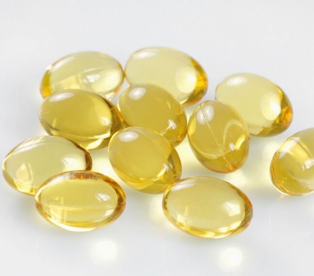 A pile of vitamin E gel capsules