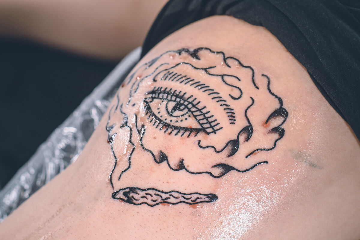 Male shoulder with new tattoo on it