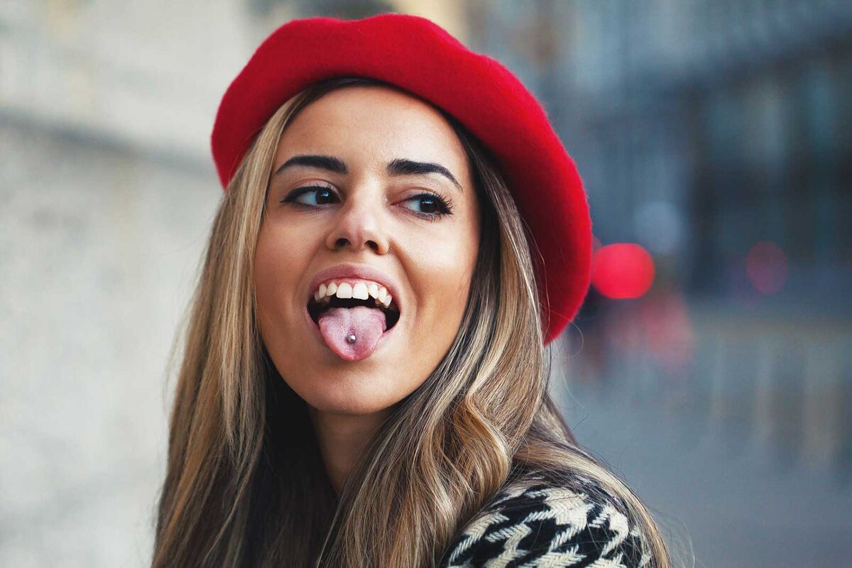 woman with tongue piercing