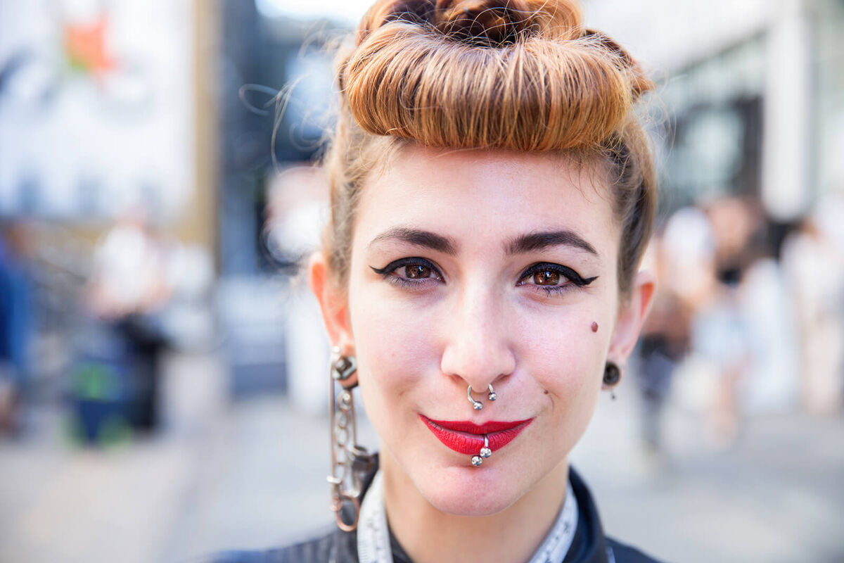 A young trendy girl with face piercings