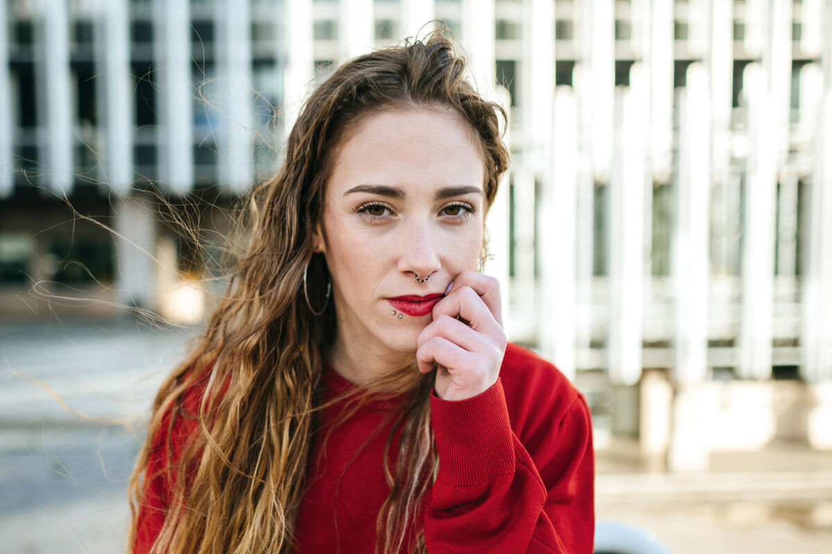 Portrait of beautiful young woman in the city
