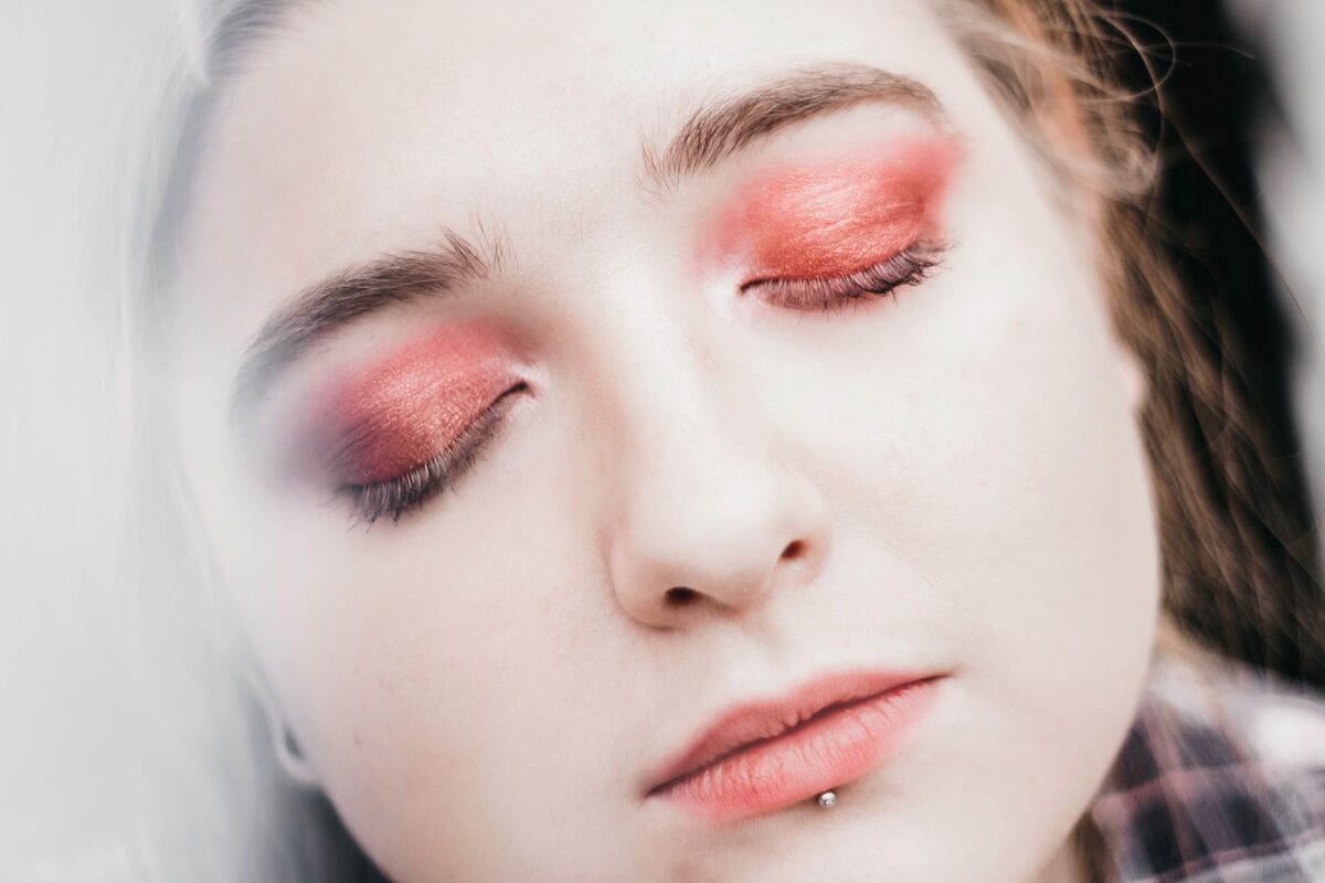 Close-Up Of Young Woman With Make-Up and Lip Pierced