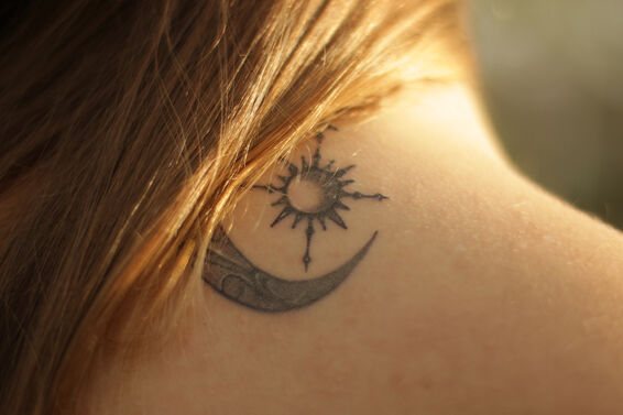 Cropped Image Of Woman With Partially Removed Tattoo On Neck