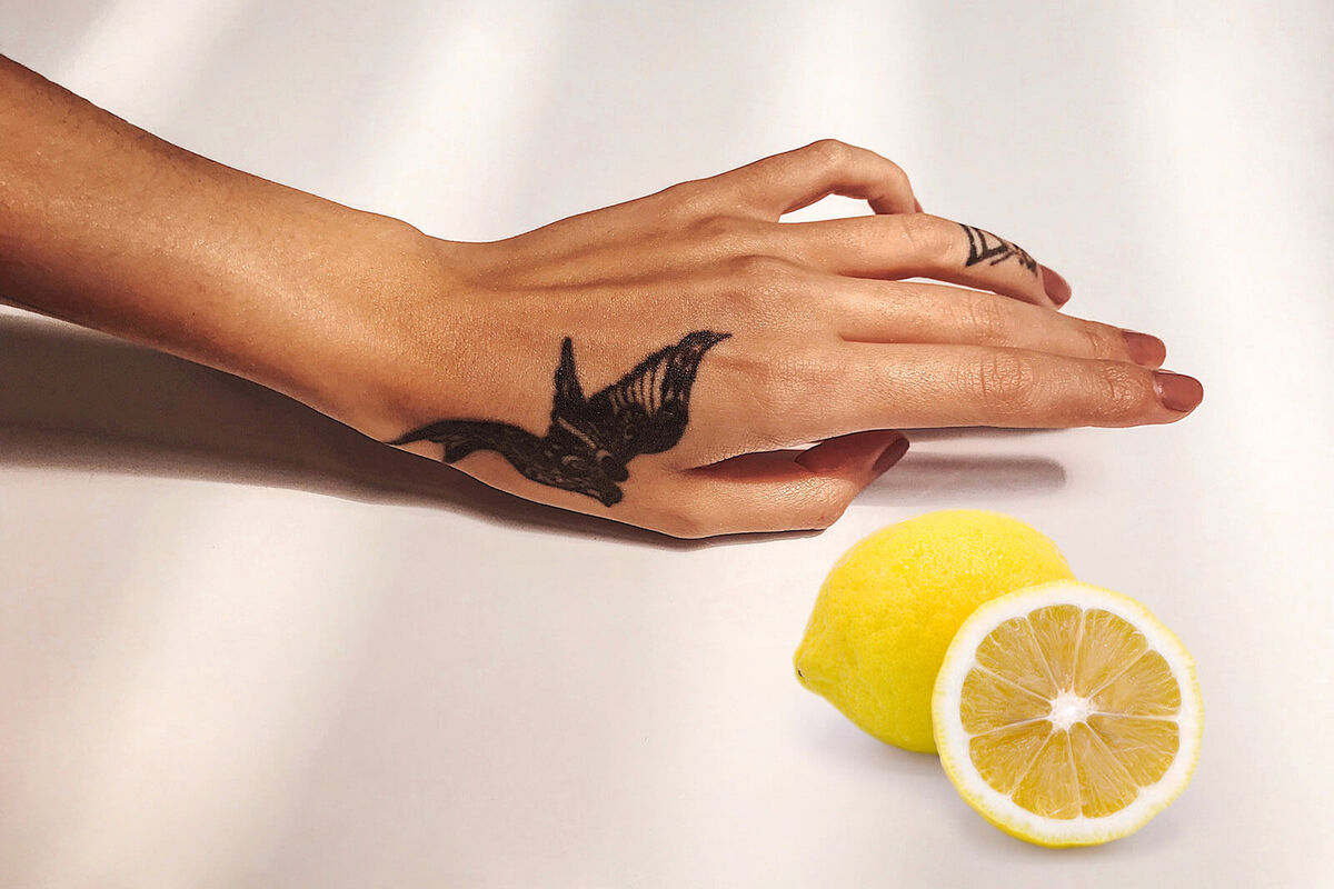 Cropped Image Of Tattooed Hand