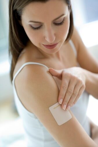 Nicotine patch on woman's arm