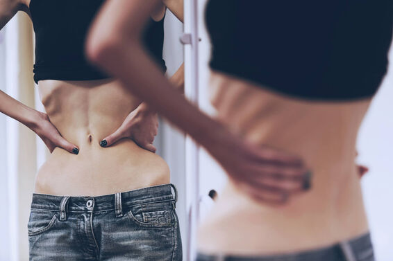 Girl with Anorexia Look in Mirror