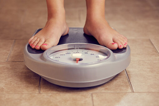 feet on a bathroom scale