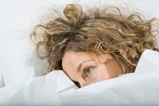 woman awake in bed