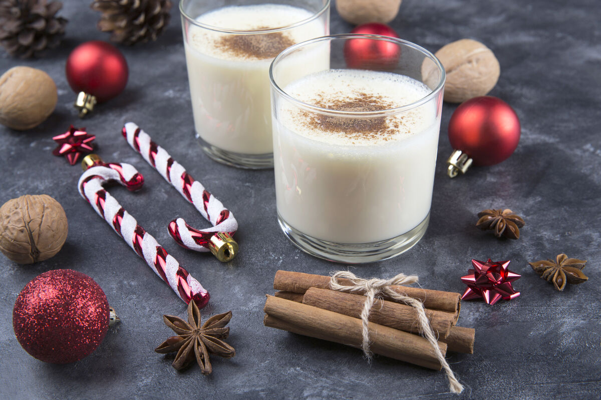 Fresh eggnog with cinnamon for christmas holiday with christmas decorations