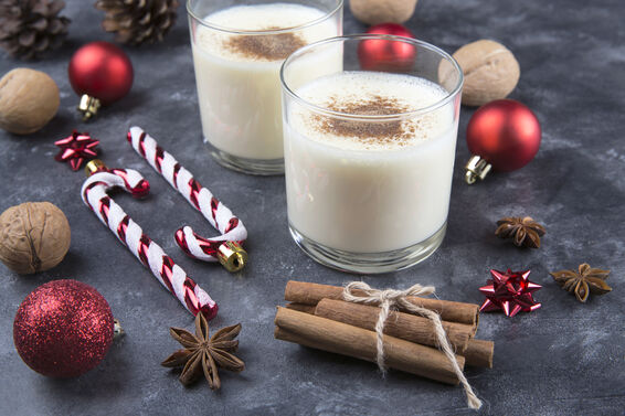 Fresh eggnog with cinnamon for christmas holiday with christmas decorations