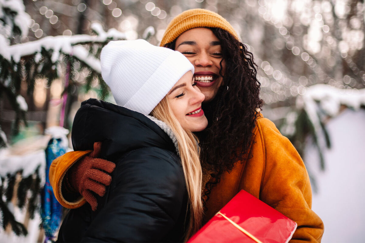 friends hugging during holidays