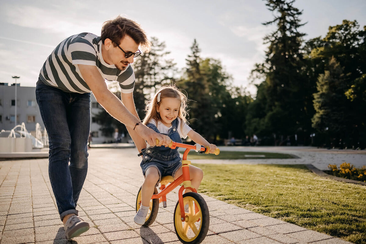 Dad with daughter outdoors