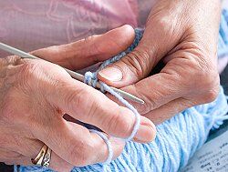 woman knitting showing adult day care