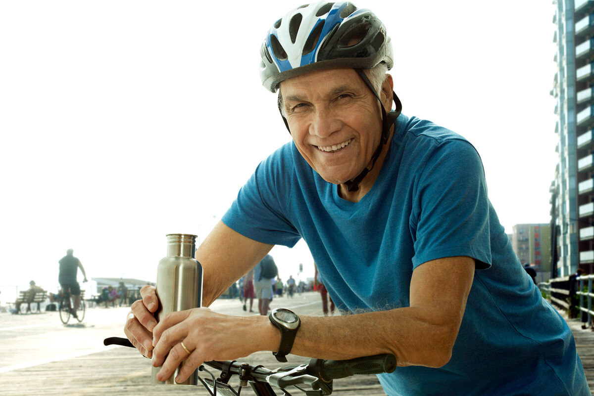 Senior man wearing bike helmet