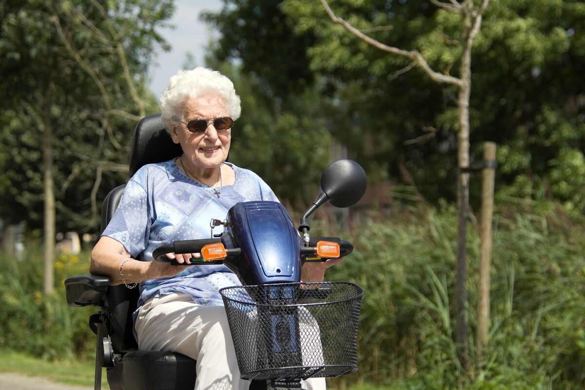 senior woman with a scooter
