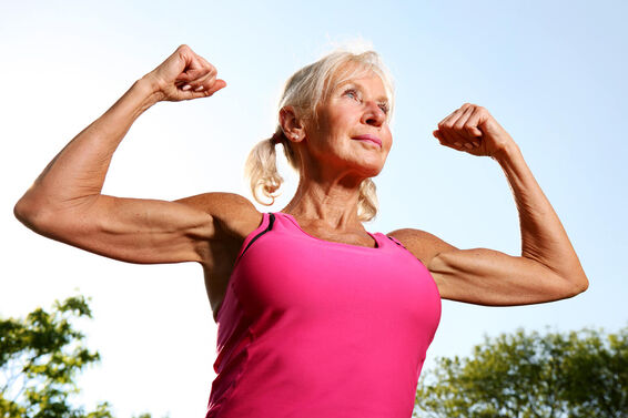 Older woman flexes muscles