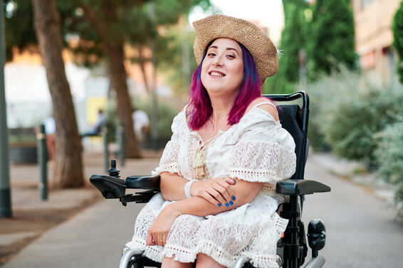 Cool woman in wheelchair looking at the camera