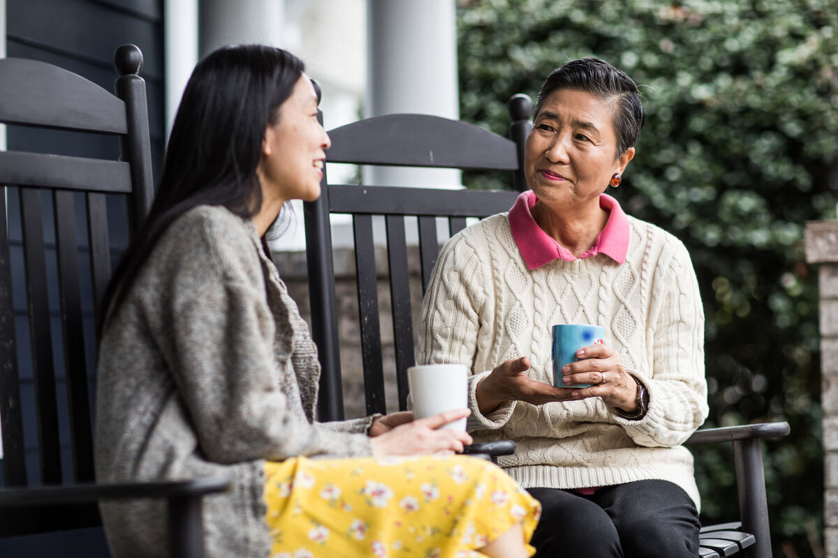 daughter spending time with elderly mother