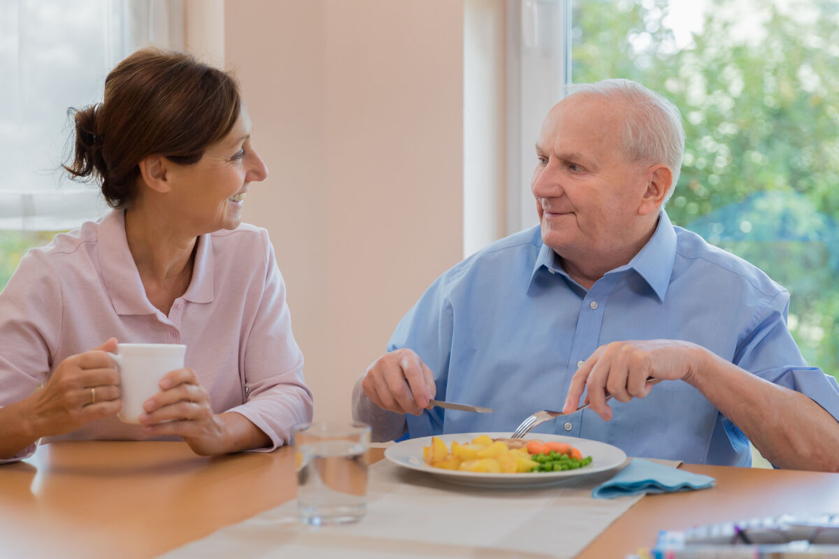 elderly man eating a healthy meal