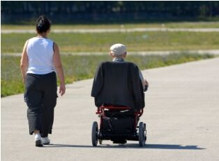 Senior citizen receiving assistance