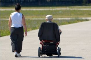Senior citizen receiving assistance