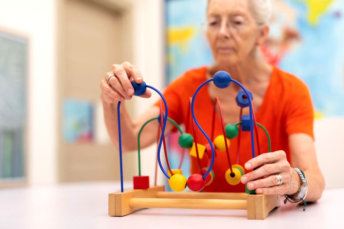 Old Woman exercise Alzheimer largest assisted living companies