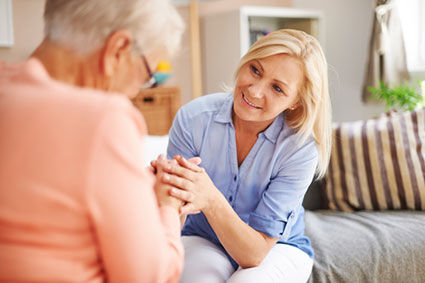 Woman talking to senior