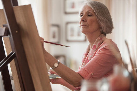 Senior woman painting
