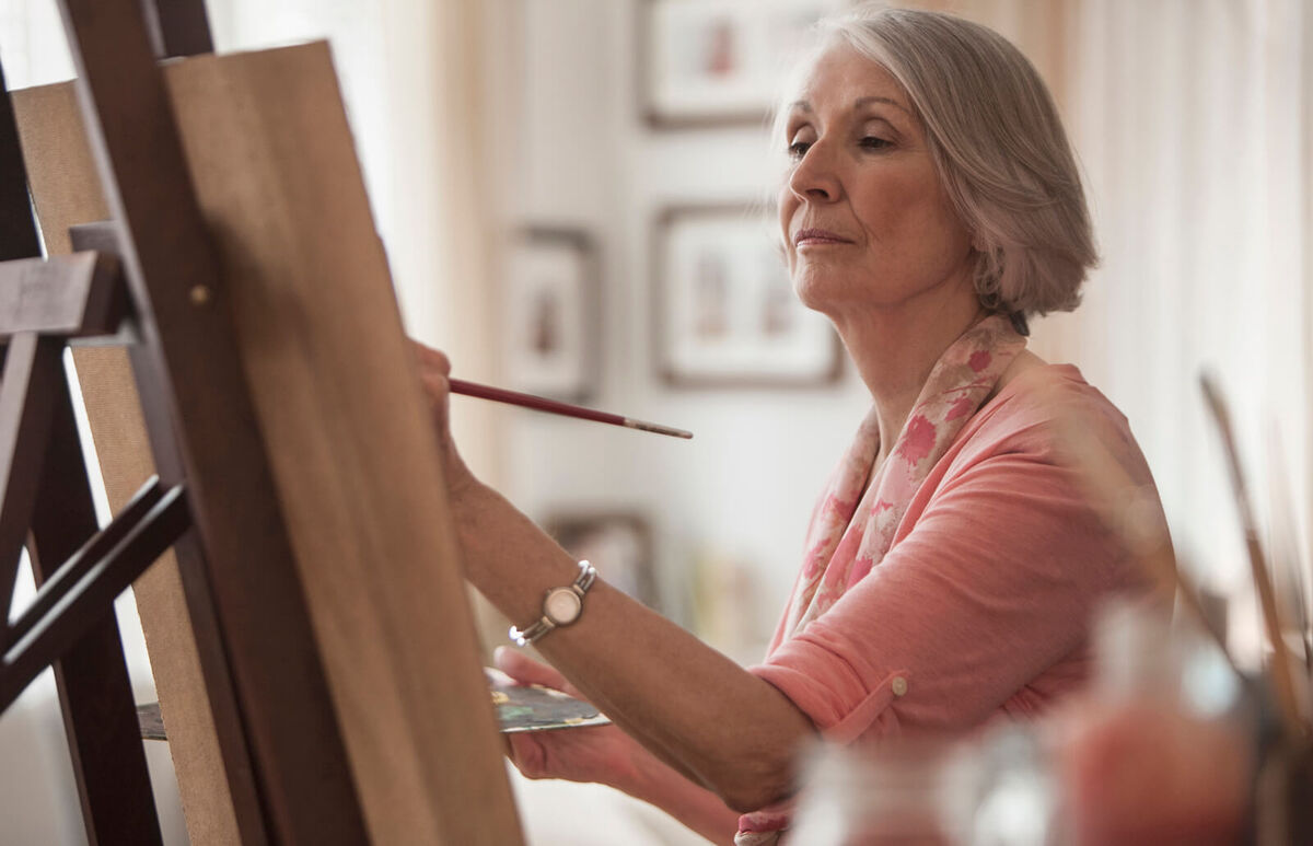 Senior woman painting