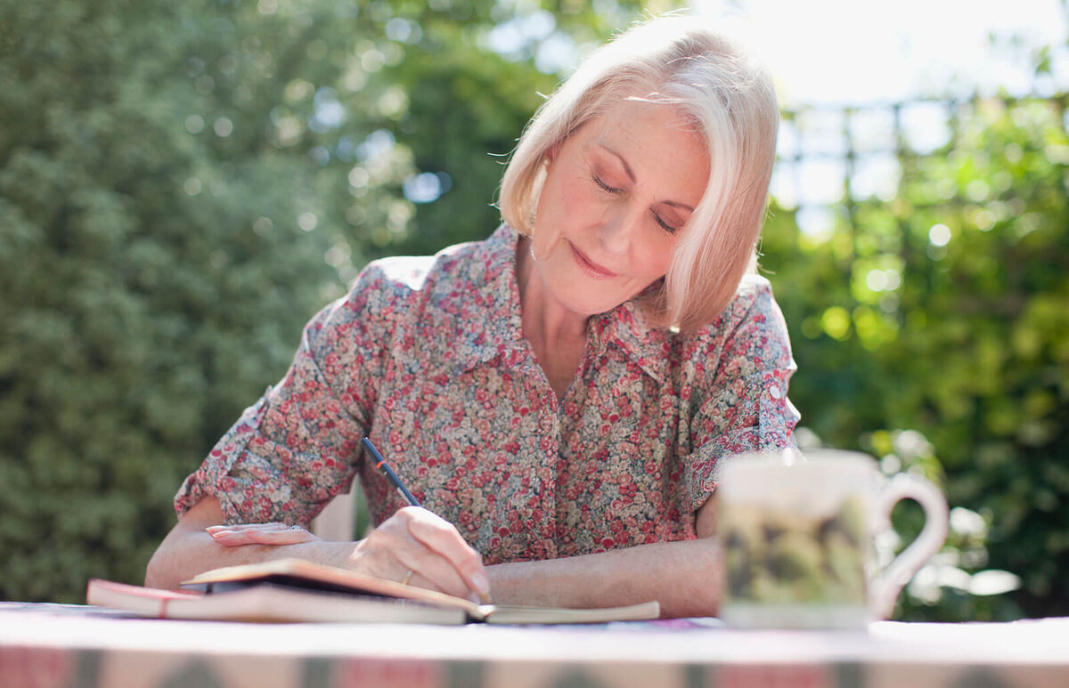 Woman writing in journal