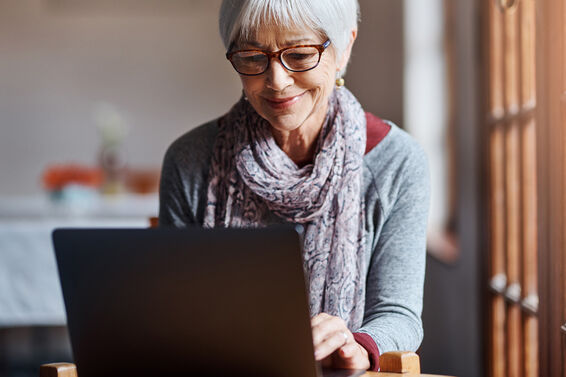senior woman using a laptop at home