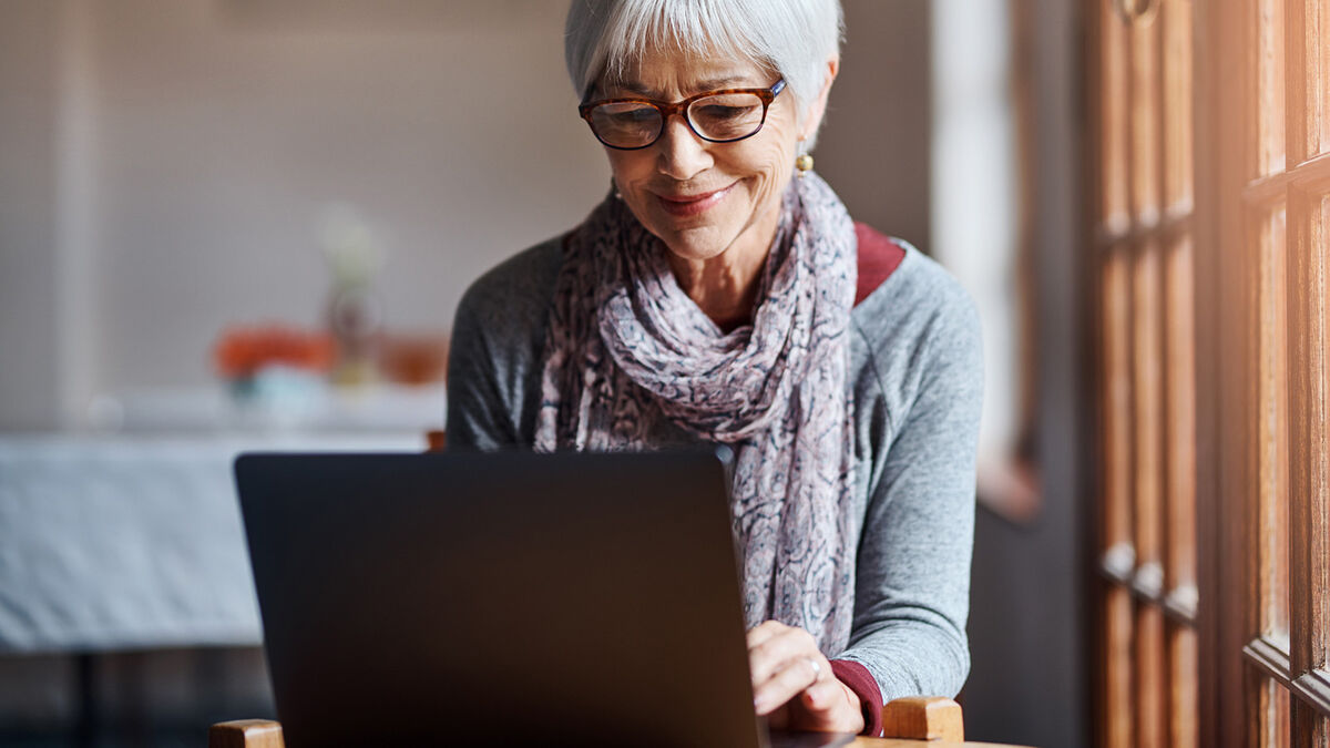 senior woman using a laptop at home