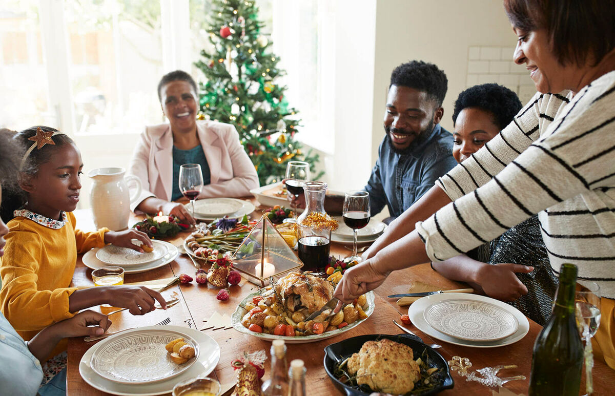 serving holiday food to family