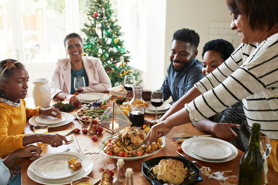 serving holiday food to family