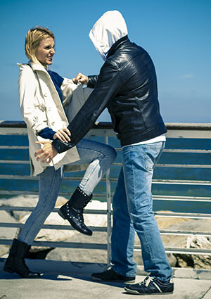 Woman warding off assailant
