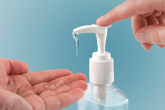 Pumping hand sanitizer into hand