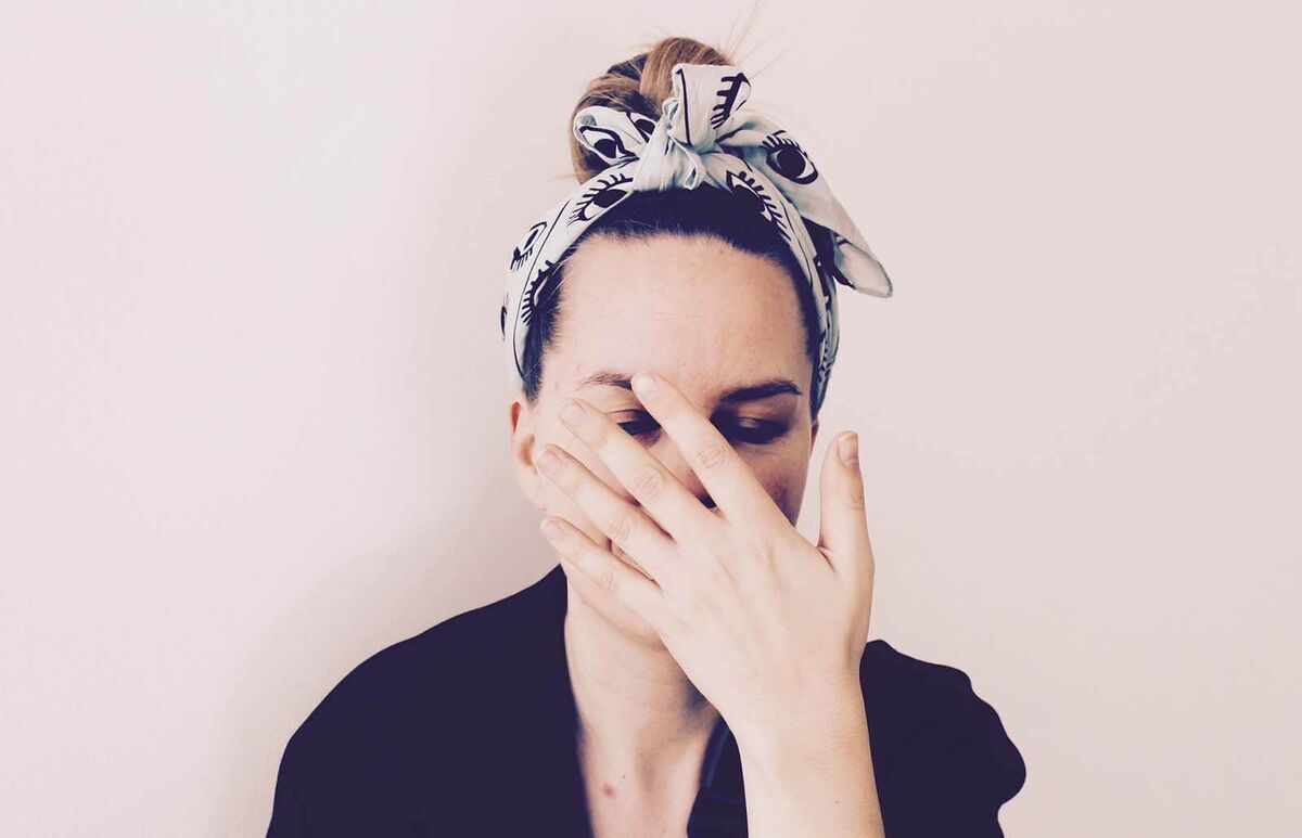 Woman touching her face